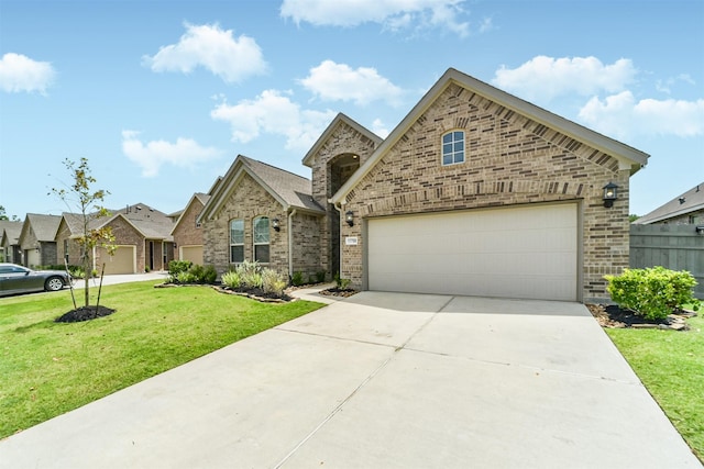 view of front of home featuring a front lawn, driveway, and brick siding