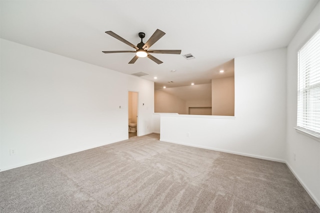 carpeted empty room with recessed lighting, a ceiling fan, visible vents, and baseboards