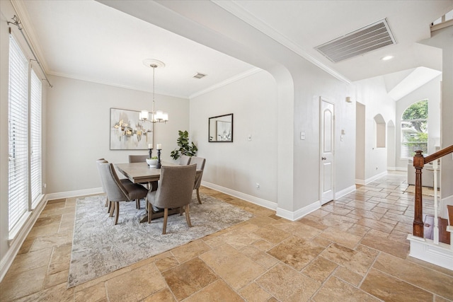 dining space with stone tile floors, arched walkways, crown molding, and visible vents