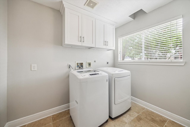 laundry area with cabinet space, independent washer and dryer, baseboards, and visible vents