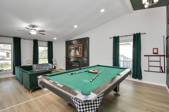 recreation room featuring a ceiling fan, light wood finished floors, billiards, and lofted ceiling