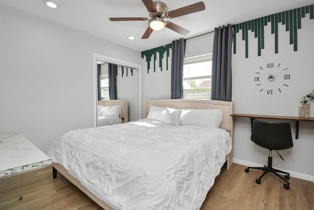 bedroom with recessed lighting, a ceiling fan, wood finished floors, and baseboards