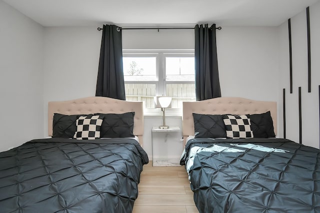bedroom featuring wood finished floors