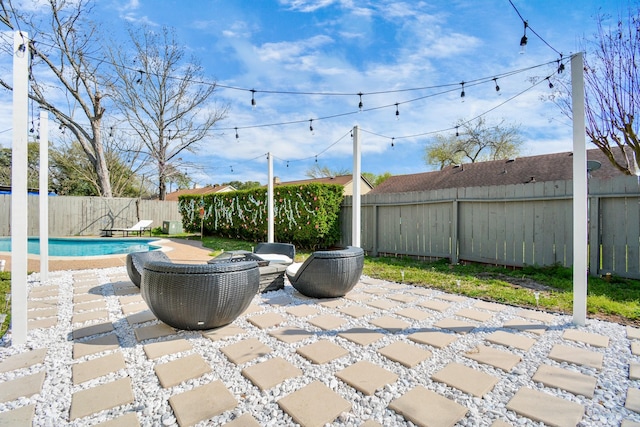 view of patio / terrace with a fenced backyard and a fenced in pool