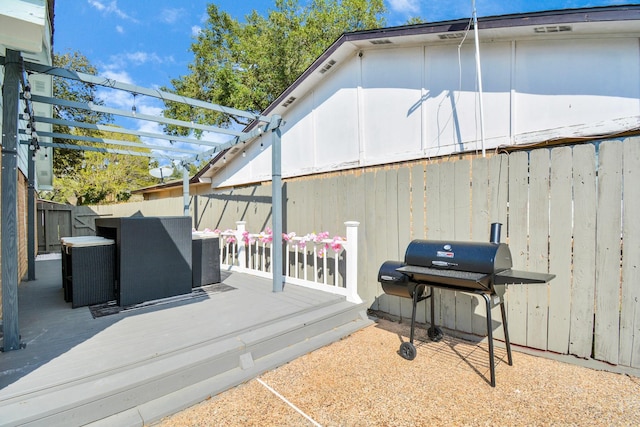exterior space with central air condition unit, area for grilling, a pergola, and a fenced backyard