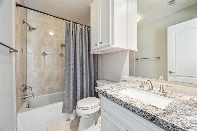 full bath featuring visible vents, tile patterned flooring, vanity, toilet, and shower / bath combo with shower curtain