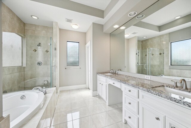 full bathroom with a sink, baseboards, a stall shower, and a bath