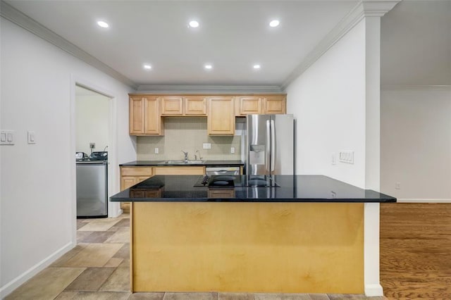 8277 Kingsbrook Rd Unit 254, Houston, TX 77024 - kitchen with washer / dryer, stainless steel appliances, ornamental molding, and a sink