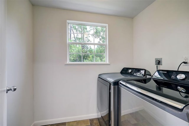 8277 Kingsbrook Rd Unit 254, Houston, TX 77024 - clothes washing area with washer and dryer, laundry area, and baseboards