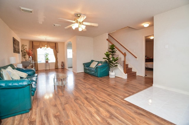 7011 Westover Ridge Dr, Houston, TX 77072 - living area featuring visible vents, stairway, and wood finished floors