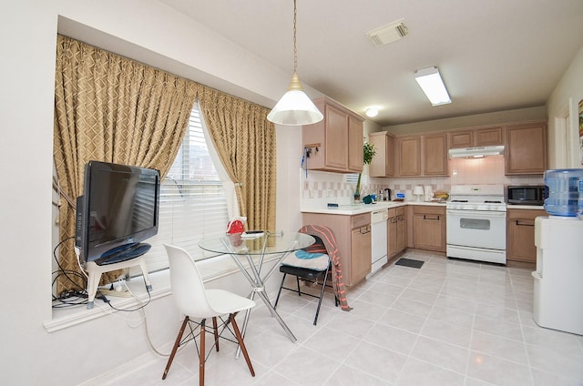 7011 Westover Ridge Dr, Houston, TX 77072 - kitchen featuring under cabinet range hood, white appliances, tasteful backsplash, visible vents, and light countertops