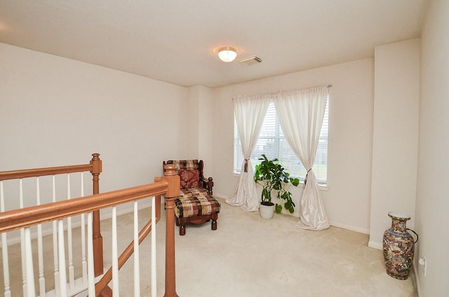 7011 Westover Ridge Dr, Houston, TX 77072 - living area with baseboards, visible vents, an upstairs landing, and carpet floors