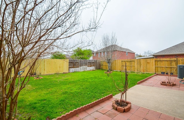 7011 Westover Ridge Dr, Houston, TX 77072 - view of yard with central AC unit, a fenced backyard, and a patio area