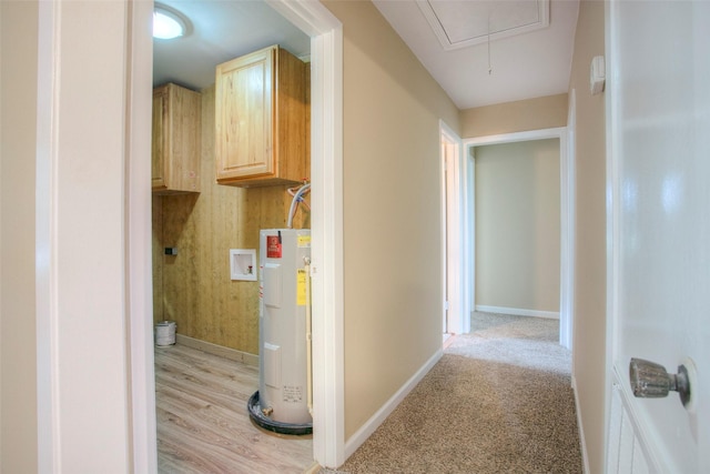 81 Westlake Rd, Trinity, TX 75862 - laundry area featuring water heater, attic access, baseboards, and washer hookup