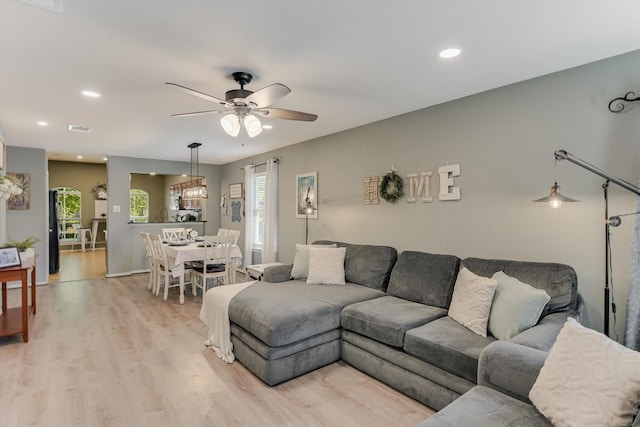 living area featuring recessed lighting, ceiling fan, light wood-style flooring, and visible vents