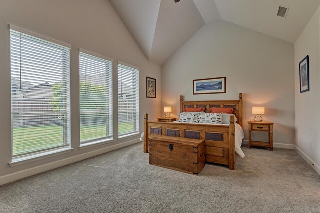 carpeted bedroom featuring visible vents, baseboards, and lofted ceiling