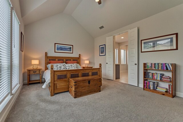 bedroom with carpet floors, baseboards, vaulted ceiling, and visible vents