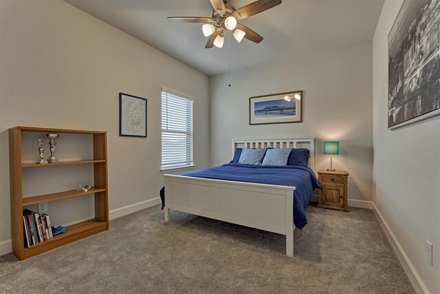 carpeted bedroom with baseboards and a ceiling fan