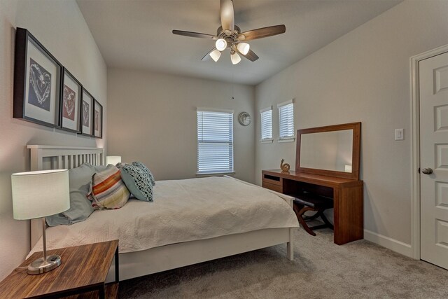 bedroom featuring baseboards, carpet flooring, and ceiling fan