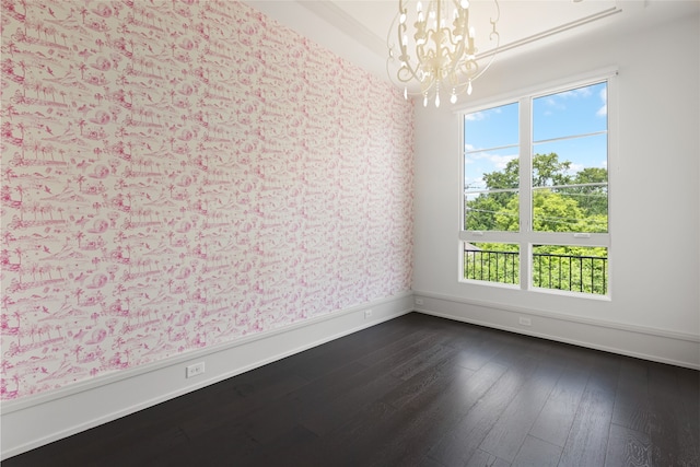 interior space with wallpapered walls, a notable chandelier, and a healthy amount of sunlight