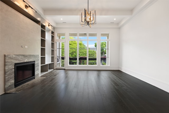unfurnished living room featuring a fireplace, baseboards, dark wood-style floors, an inviting chandelier, and recessed lighting