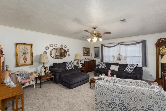 carpeted living area with visible vents, a ceiling fan, and a textured ceiling