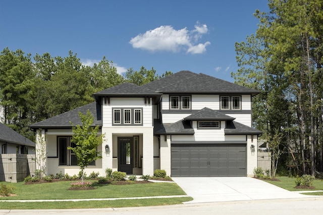 17335 Sunflower Petals Trl, Conroe, TX 77302 - prairie-style home with driveway, roof with shingles, an attached garage, fence, and a front lawn