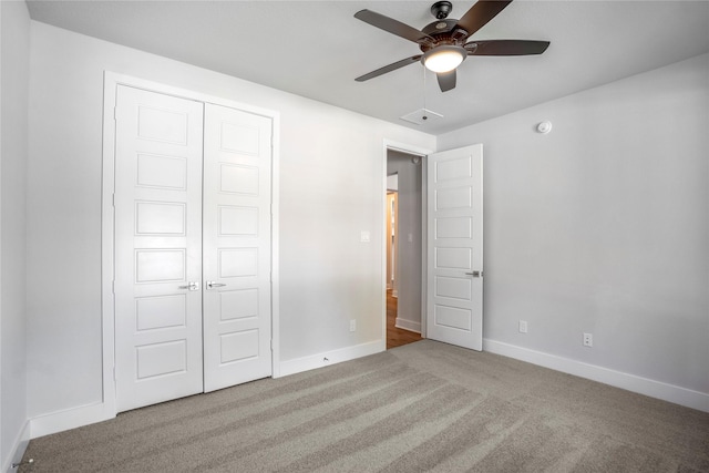 17335 Sunflower Petals Trl, Conroe, TX 77302 - unfurnished bedroom featuring baseboards, ceiling fan, carpet floors, and a closet