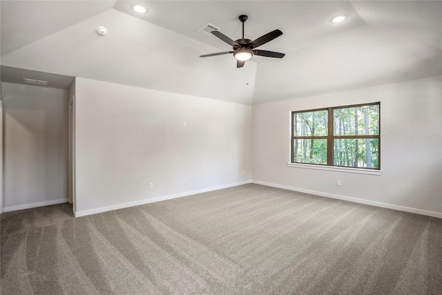 17335 Sunflower Petals Trl, Conroe, TX 77302 - spare room featuring lofted ceiling, baseboards, recessed lighting, and carpet floors