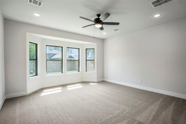 17335 Sunflower Petals Trl, Conroe, TX 77302 - empty room with baseboards, visible vents, and carpet floors