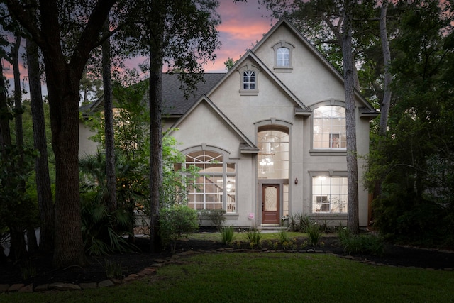 view of front of property featuring a front yard and stucco siding