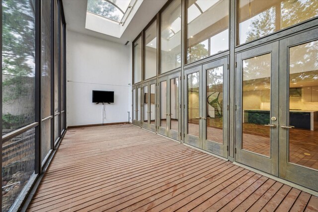 5756 Indian Cir, Houston, TX 77057 - unfurnished sunroom with french doors, plenty of natural light, and a skylight
