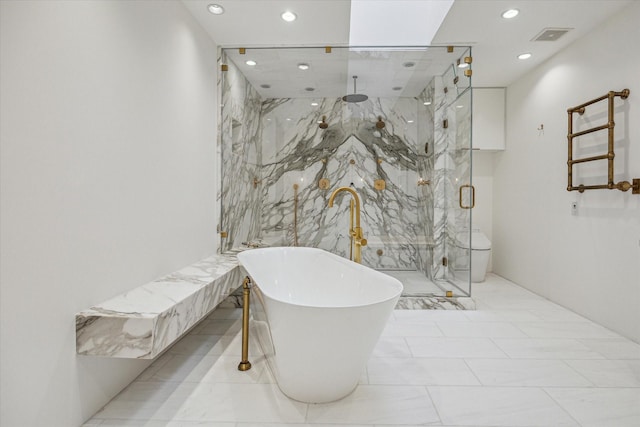 5756 Indian Cir, Houston, TX 77057 - full bathroom featuring recessed lighting, a marble finish shower, visible vents, and a freestanding tub