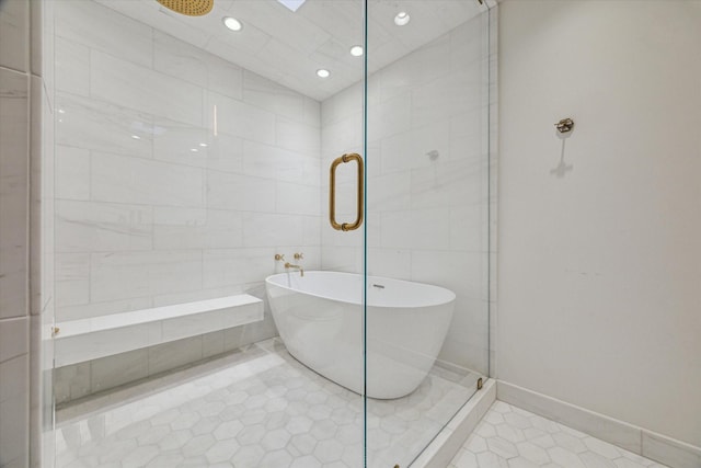 5756 Indian Cir, Houston, TX 77057 - full bath featuring a soaking tub, recessed lighting, a stall shower, and tile patterned floors