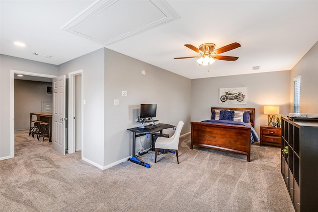 carpeted bedroom with attic access, a ceiling fan, visible vents, and baseboards