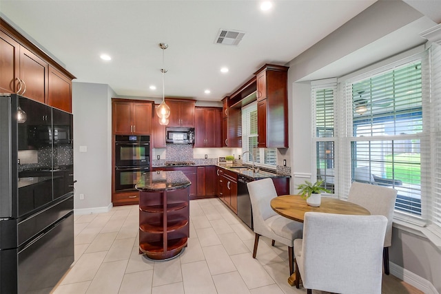 1416 Blueberry Ln, Friendswood, TX 77546 - kitchen with black appliances, plenty of natural light, backsplash, and recessed lighting