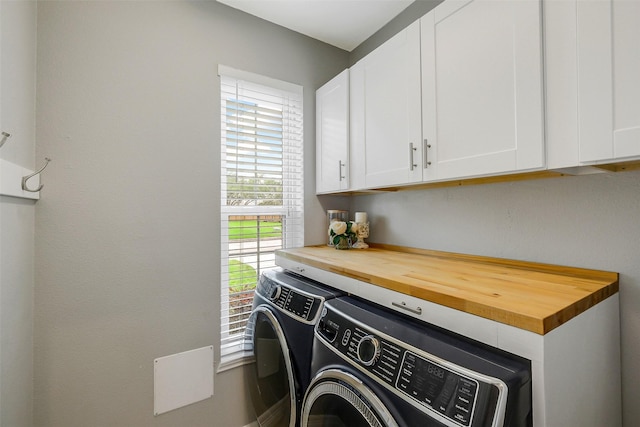 laundry area featuring cabinet space and independent washer and dryer