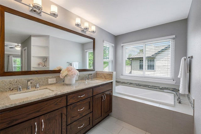 full bath with tile patterned floors, double vanity, a bath, and a sink