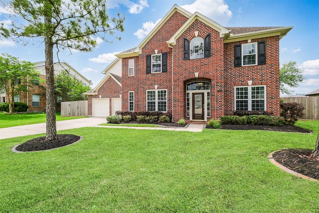 1416 Blueberry Ln, Friendswood, TX 77546 - colonial-style house featuring brick siding, driveway, and a garage