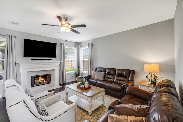 1416 Blueberry Ln, Friendswood, TX 77546 - living room with ceiling fan, wood finished floors, a tile fireplace, and baseboards