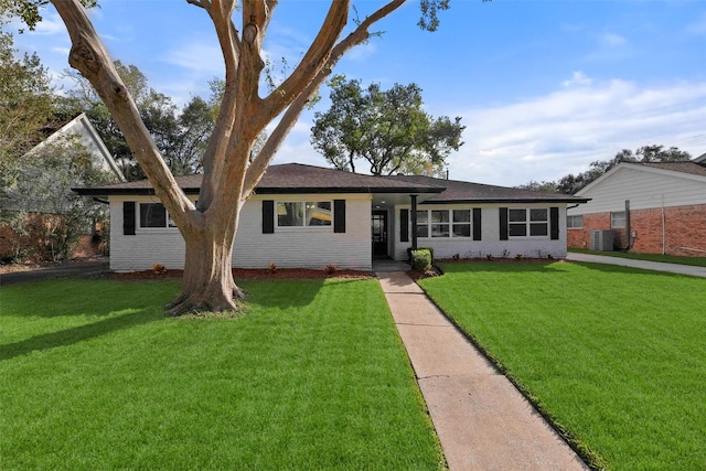 6235 Dumfries Dr, Houston, TX 77096 - single story home featuring central AC, a front yard, and brick siding