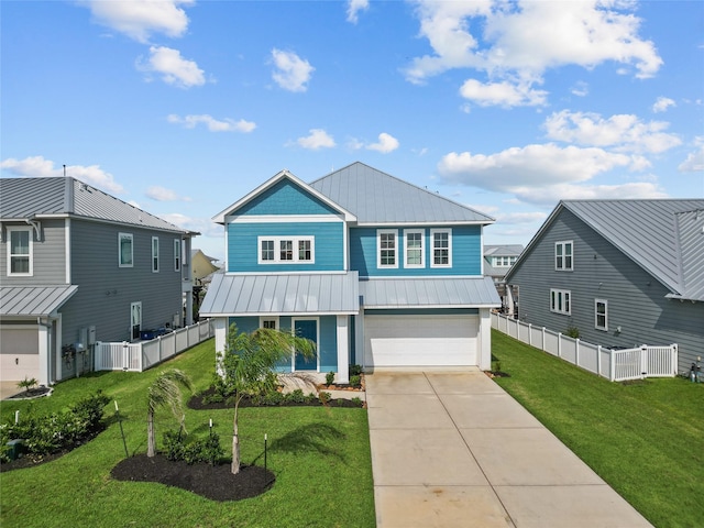 5205 Brigantine Cay Ct, Texas City, TX 77590 - coastal home featuring fence, metal roof, a garage, a front lawn, and concrete driveway