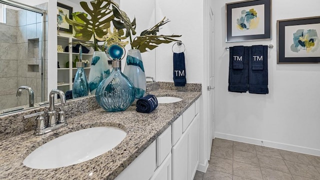 7703 Basil Ridge Dr, Cypress, TX 77433 - full bath with baseboards, a sink, a stall shower, and double vanity