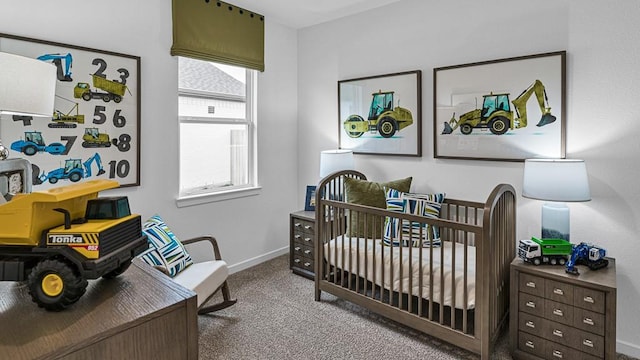 7703 Basil Ridge Dr, Cypress, TX 77433 - carpeted bedroom with baseboards and a crib