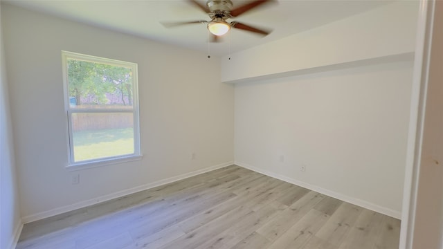 5236 Perry St, Houston, TX 77021 - unfurnished room with light wood-style floors, a ceiling fan, and baseboards