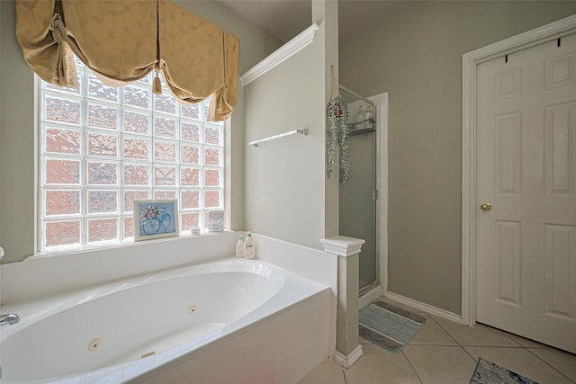 full bath with a tub with jets, tile patterned flooring, a shower stall, and baseboards
