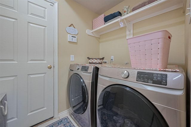 laundry room featuring washing machine and clothes dryer and laundry area