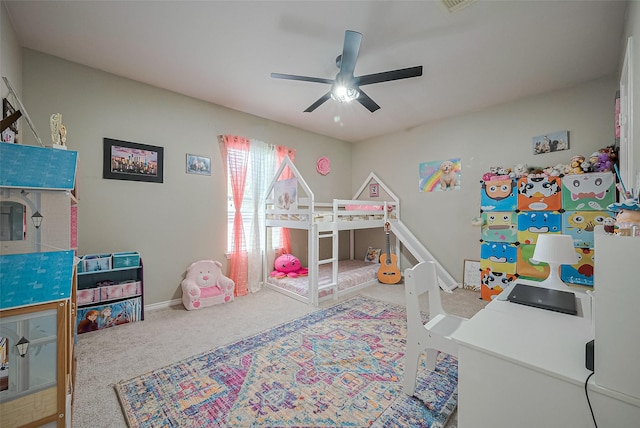 bedroom with ceiling fan, carpet floors, and baseboards