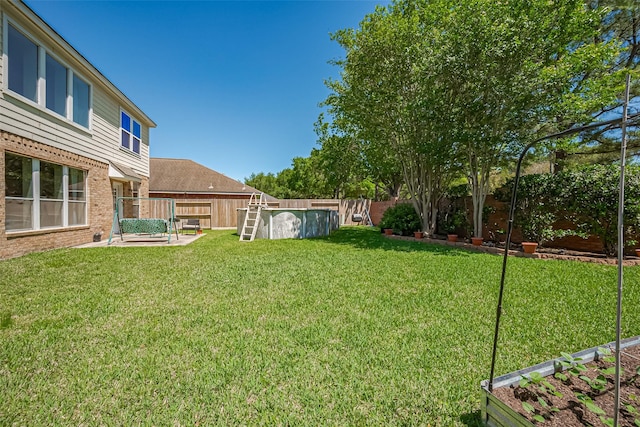 view of yard featuring a fenced backyard and a patio area