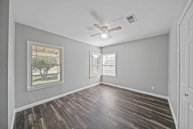 unfurnished bedroom featuring visible vents, a ceiling fan, baseboards, and dark wood-style flooring